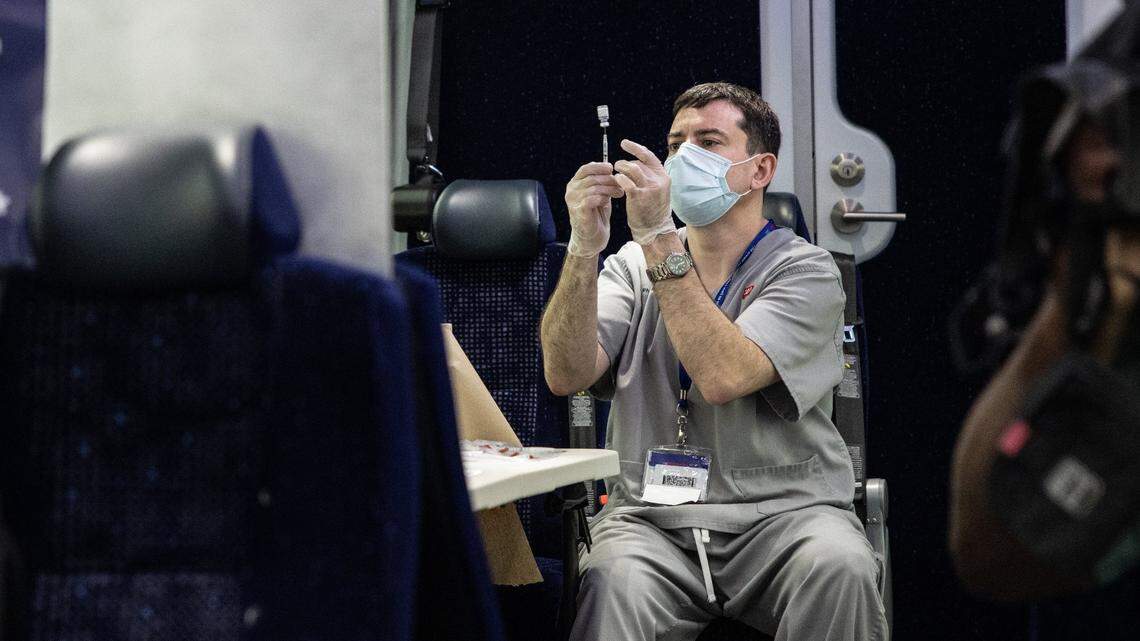 Chad Moss draws COVID-19 shots at a pop-up vaccination event in Mint Hill, N.C., on September 1, 2021.