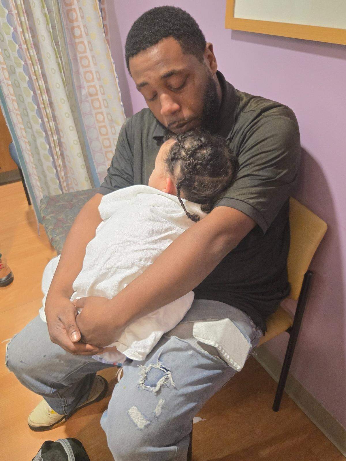 Quay Horne holds his daughter Aria before her surgery at Levine Children’s Hospital on Nov. 4.