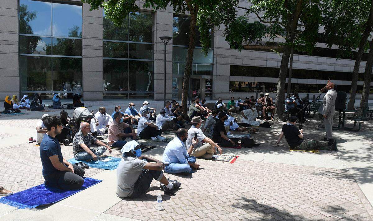 Outside the Charlotte-Mecklenburg Government Center in 2020, the Islamic Center of Charlotte hosted a Friday Prayer, or Jumuah. A national Muslim civil-rights group is demanding a hate-crime probe of a phone call to the mosque.