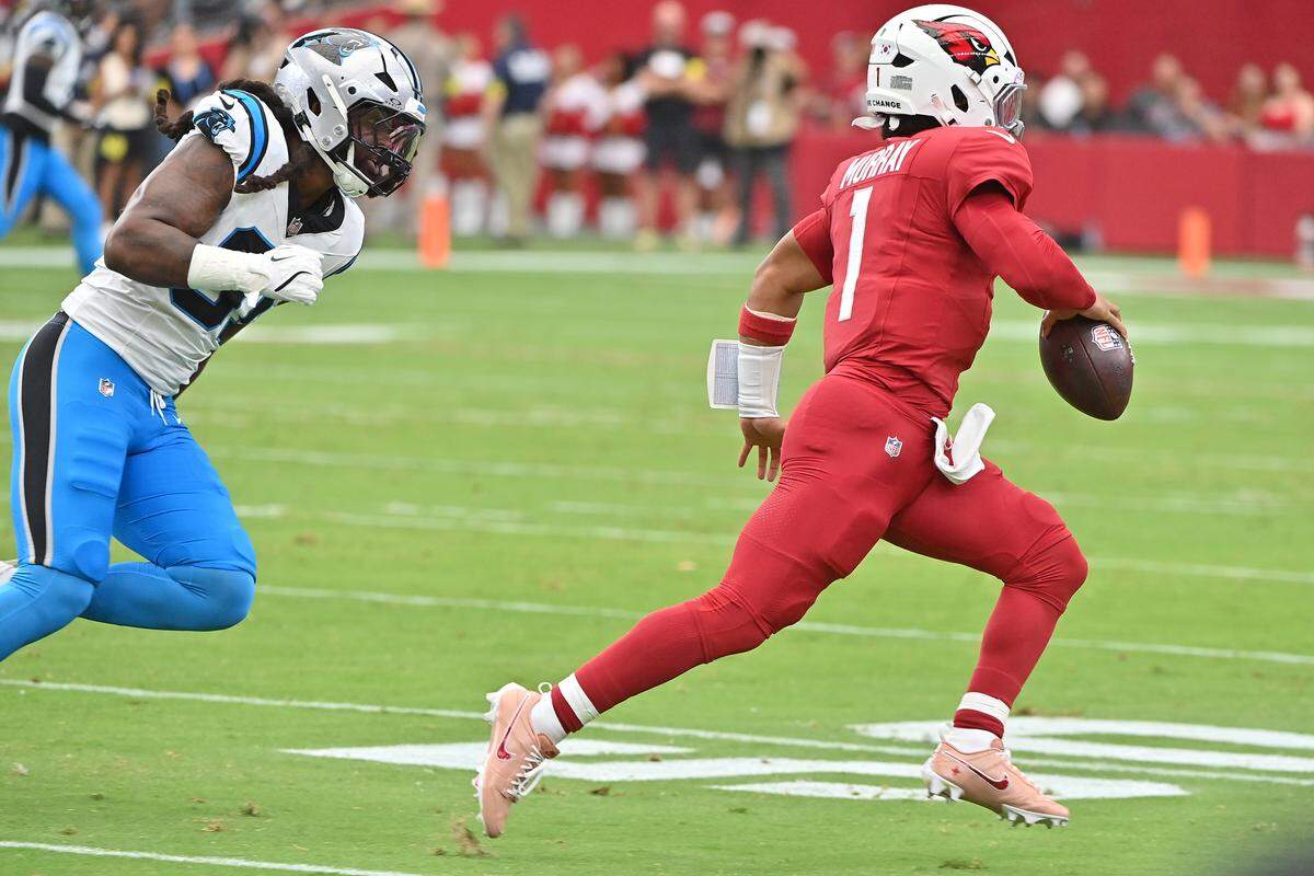 Arizona Cardinals quarterback Kyler Murray (1) runs the ball during the first quarter against Carolina Panthers linebacker Patrick Jones II (91) on Sept. 14.