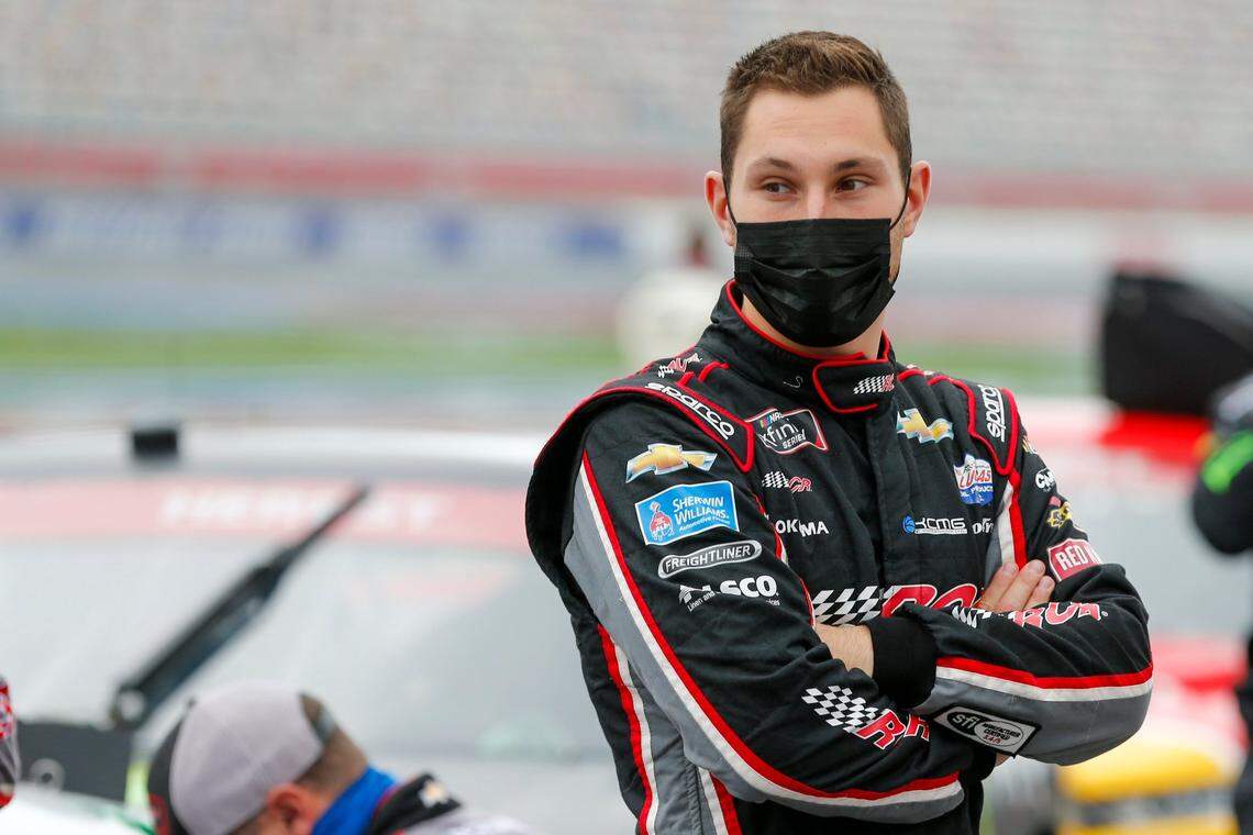 Kaz Grala stands by his car before the Xfinity Series race at Charlotte Motor Speedway in Concord on Saturday.