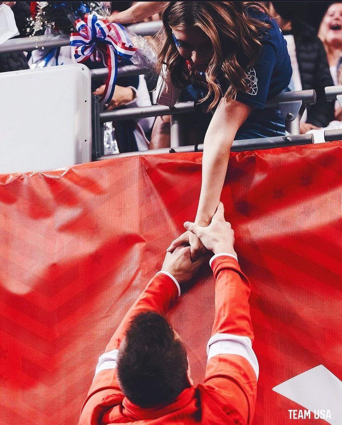 Sam Mikulak and Mia Atkins lock hands at the U.S. Olympic Trials last month in St. Louis.