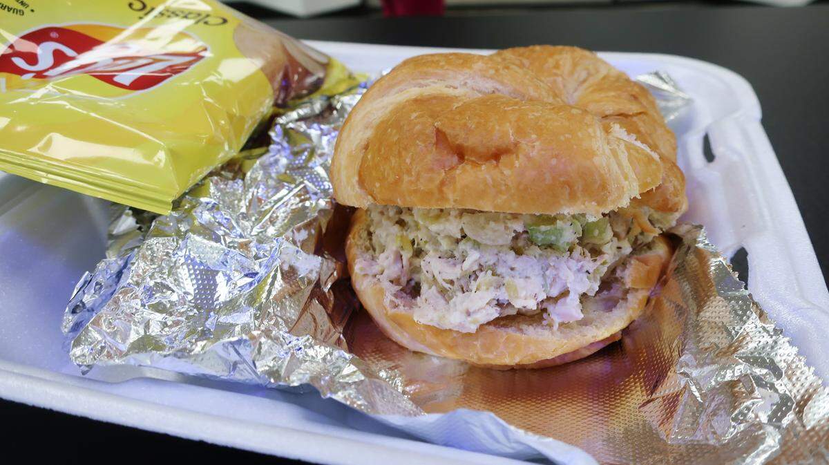 Stephie’s Kitchen’s chicken salad on a croissant with chips.