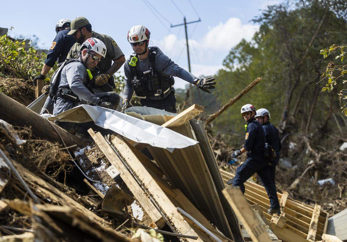 A FEMA search and rescue team from Maryland search for human remains in debris from a structure in Swannanoa on Oct. 6, 2024. 