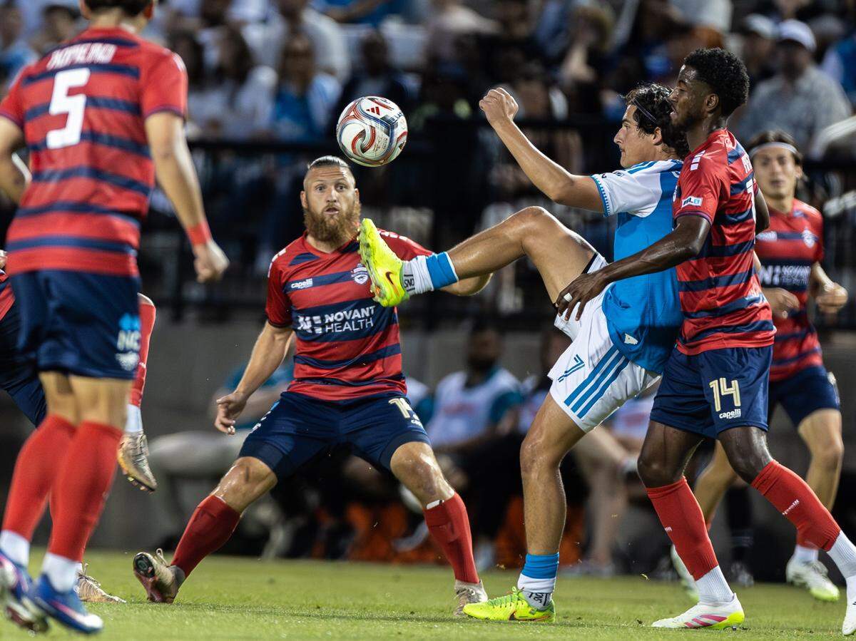 Charlotte FC forward Archie Goodwin, center, kicks the ball against the Charlotte Independence at Mecklenburg County Regional Sportsplex in Matthews, N.C., on Wednesday, April 15, 2026. 