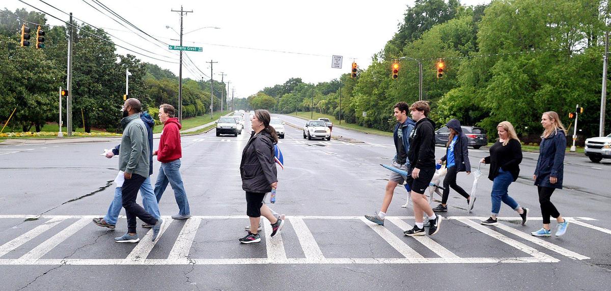 Parents and students from the Olde Providence subdivision walked to Providence High School to demonstrate how close the school is to their neighborhood. Currently, students from the Olde Providence community go to Myers Park High, but the redrawing will send them to South Mecklenburg High School.