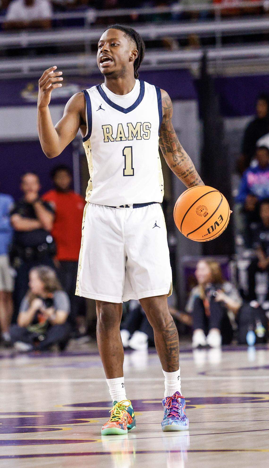 Reidsville point guard Dionte Neal (1) signals the offensive during the NCHSAA 4-A Eastern Regional Basketball Championship game with Washington at Eastern Carolina University in Greenville, N.C., on Saturday, March 7, 2026.