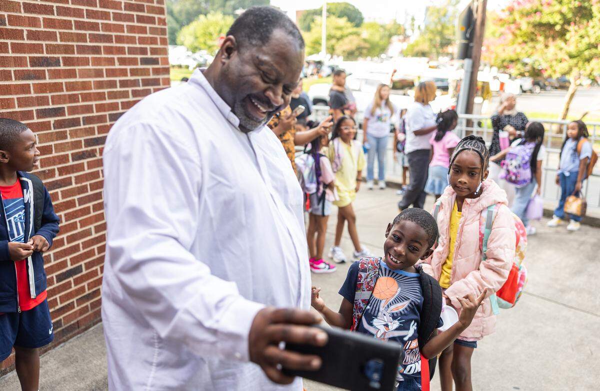 Students arrive for the first day of school at Elizabeth Traditional School in Charlotte, N.C., on Monday, August 25, 2025.