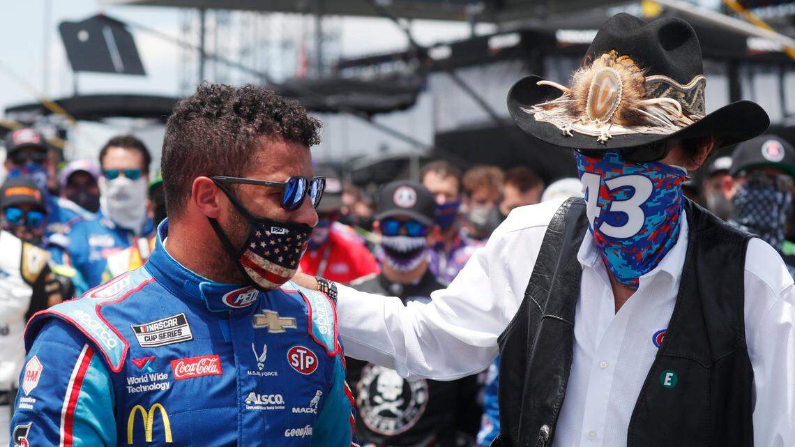 Team owner Richard Petty, right, consoles driver Bubba Wallace prior to the start of the NASCAR Cup Series at the Talladega Superspeedway on Monday.