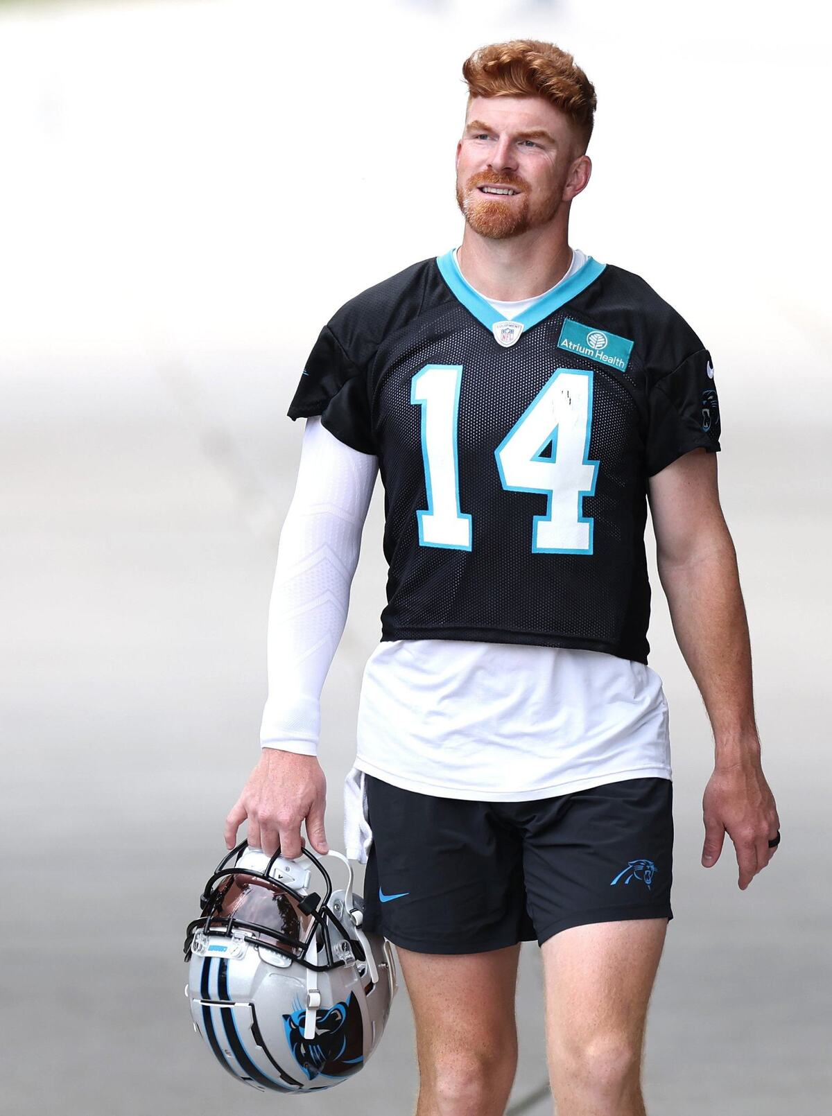 Carolina Panthers quarterback Andy Dalton walks to the team’s OTA practice on Tuesday, June 4, 2024.