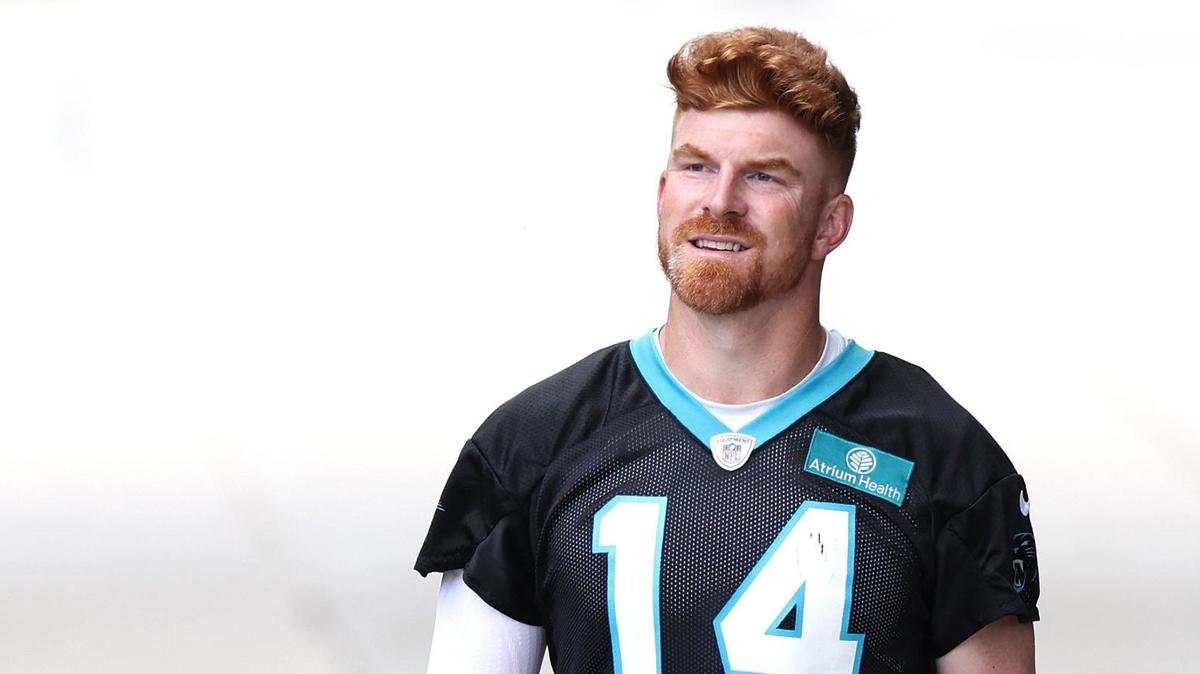 Carolina Panthers quarterback Andy Dalton walks to the team’s OTA practice on Tuesday, June 4, 2024.