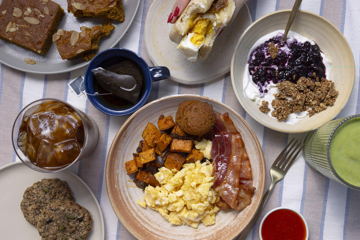 A breakfast bowl with eggs, sweet potatoes and bacon, a yogurt bowl and several drinks from FARE.