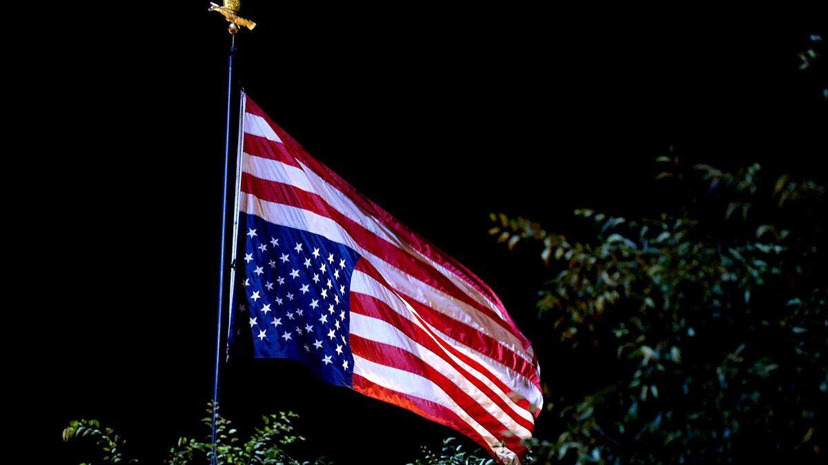 The American flag is turned upside down during a protest in Charlotte, NC. A Fresno reader says they no longer call themselves a patriot under Trump, citing ICE, xenophobia and a government steering the nation away from its ideals.                 