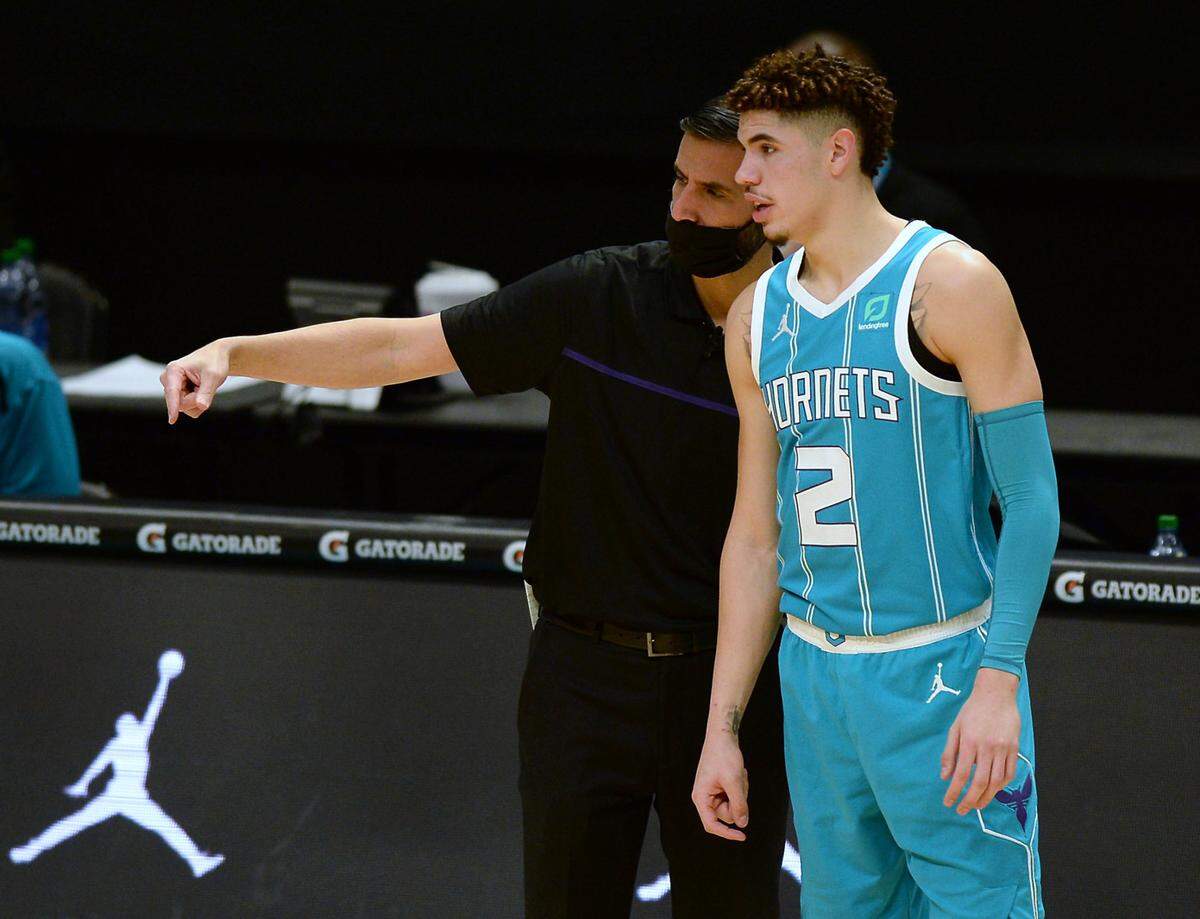 Charlotte Hornets coach James Borrego, left, said of LaMelo Ball Saturday night: “A 19-year-old rookie does not look like this. This is just rare, what you’re seeing.”