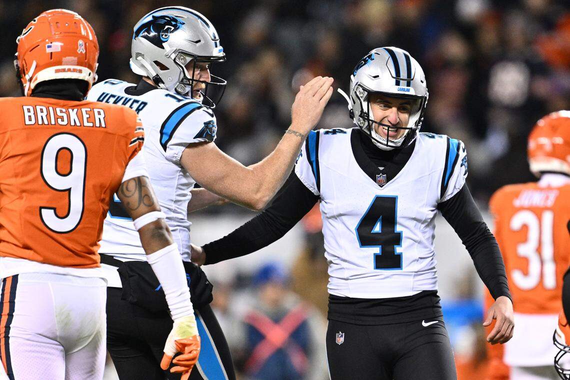 Nov 9, 2023; Chicago, Illinois, USA; Carolina Panthers kicker Eddy Pineiro (4) celebrates with punter Johnny Hekker (10) after kicking a 33-yard field goal in the first half against the Chicago Bears at Soldier Field. Mandatory Credit: Jamie Sabau-USA TODAY Sports
