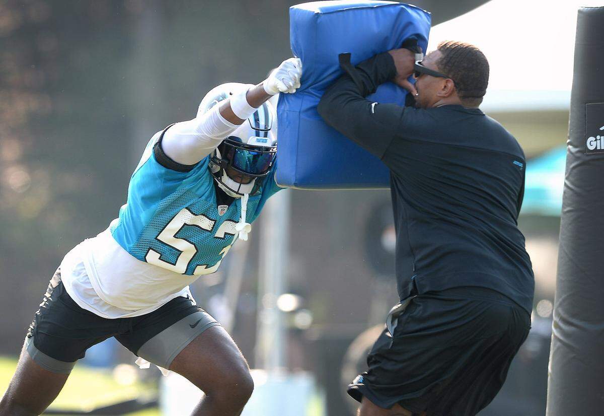 Carolina Panthers defensive end Brian Burns, left, forces a team member to backpedal during a drill on Thursday, July 29, 2021 at Wofford College in Spartanburg, SC.