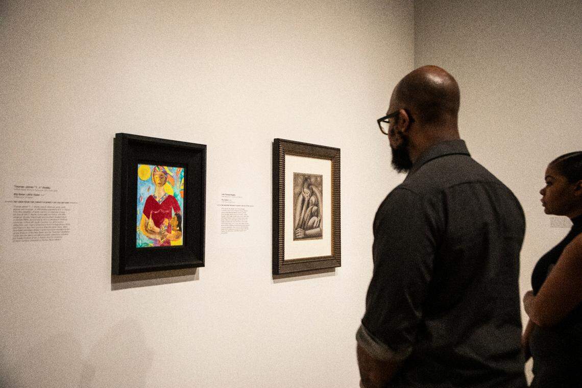 Viewers admire artwork at The Mint Museum.
