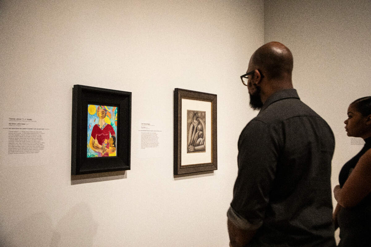 Viewers admire artwork at The Mint Museum.