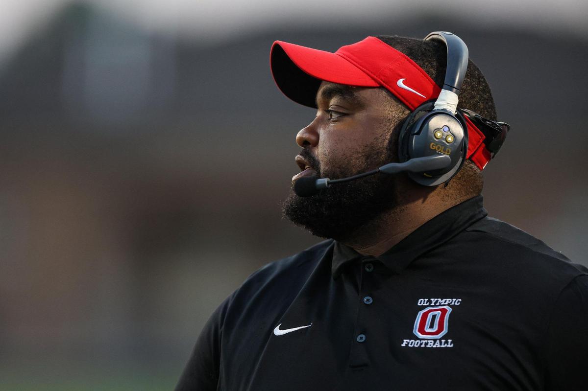 Olympic’s head coach Brandon Thompson watches from the sidelines during the game against Harding University High School;on Friday, September 16, 2022 in Charlotte, NC.