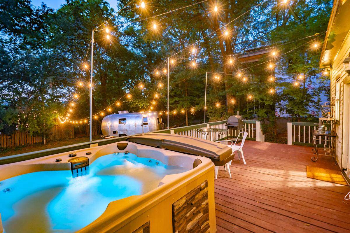 This Charlotte rental, complete with backyard hot tub, photo-friendly retro Airstream and fire pit, was listed for $5,985 a night during the RNC before COVID-19 arrived.