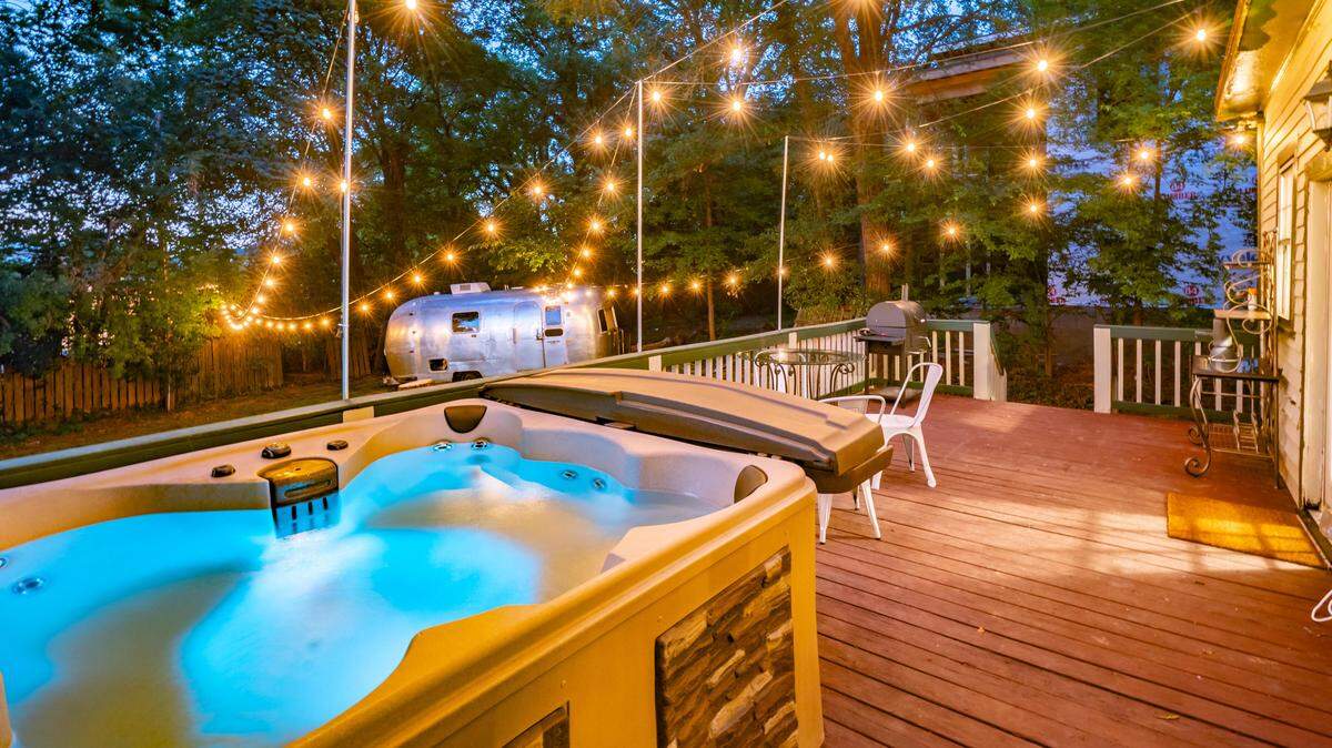 This Charlotte rental, complete with backyard hot tub, photo-friendly retro Airstream and fire pit, will be listed for $5,985 a night during the RNC.
