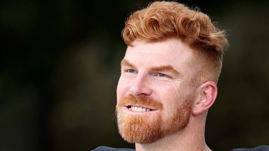 Carolina Panthers quarterback Andy Dalton smiles as he walks to practice with his teammates on Wednesday, September 25, 2024.