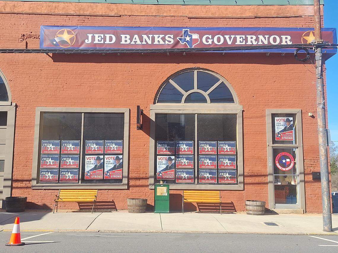 Jed Banks campaign signs filled the windows of a building in downtown Mooresville on Tuesday.