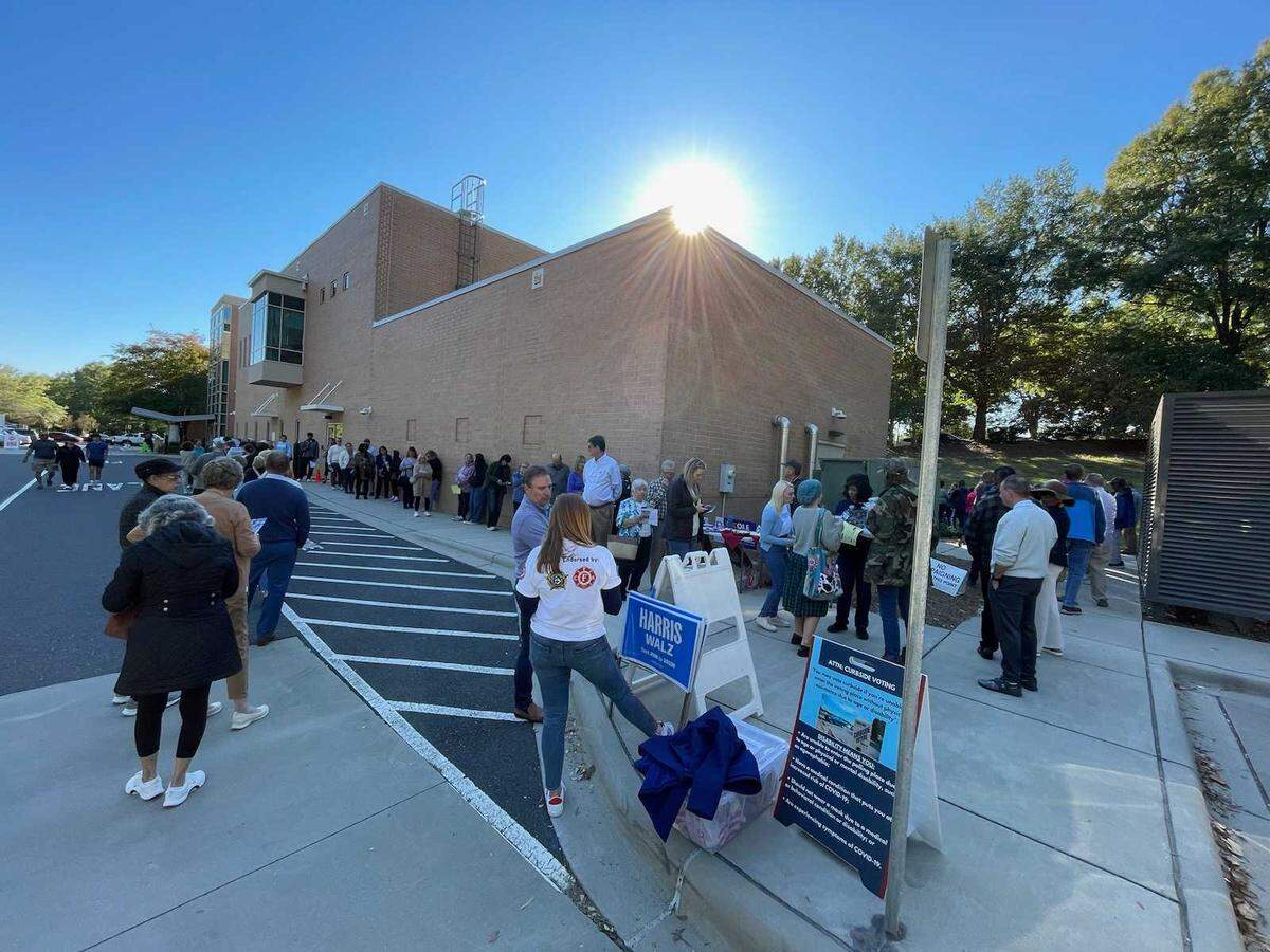 The line to vote at the South County Regional Library in Charlotte on Monday afternoon wrapped around the building.
