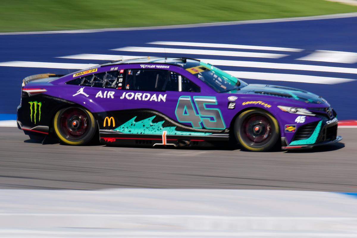 Oct 8, 2023; Concord, North Carolina, USA; NASCAR Cup Series driver Tyler Reddick (45) enters turn one during the Bank of America Roval 400 at Charlotte Motor Speedway Road Course. Mandatory Credit: Jim Dedmon-USA TODAY Sports