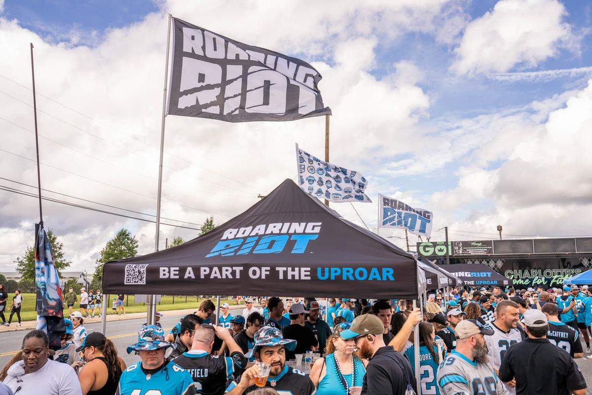 Roaring Riot fans gather before a home game on Morehead Avenue near Bank of America Stadium.