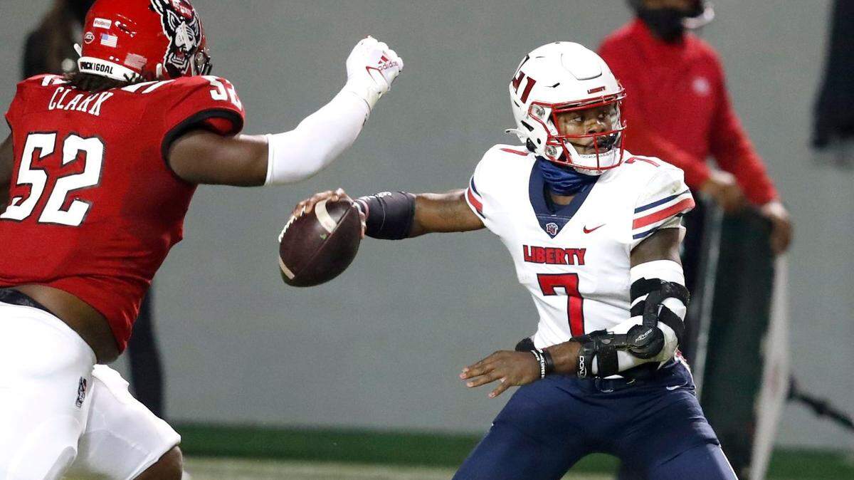 Liberty quarterback Malik Willis (7), pictured here playing against N.C. State last season, met with the Carolina Panthers during Day 1 of Senior Bowl practice on Tuesday.