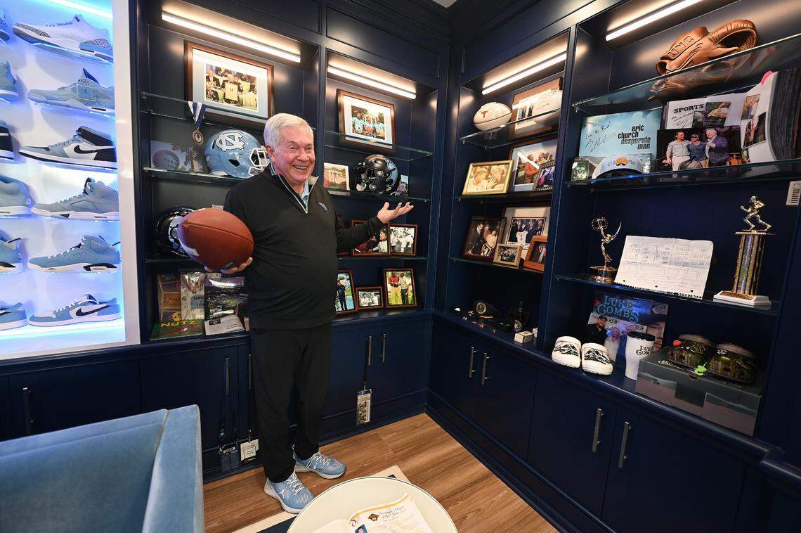 UNC Tar Heels head football coach Mack Brown smiles as he speaks about a portion of the memorabilia he has collected during his coaching career on Friday, June 14, 2024. Brown led Texas to a National Championship in 2005 and returned to UNC for his second stint with the team in 2019. Brown is a member of the College Football Hall of Fame.