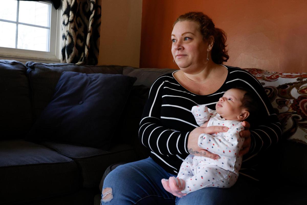 Erin O’Malley of Charlotte, photographed with her 1-month-old daughter Lennox “Lenni” O’Malley at her home earlier this month.