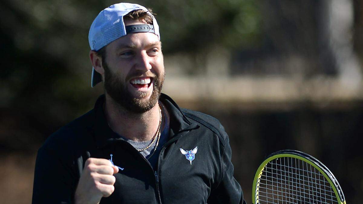 Professional tennis player Jack Sock pumps his fist after winning a point against his coach Alex Bogomolov Jr. at the Cabarrus Country Club in Concord, NC on Wednesday, January 20, 2021.