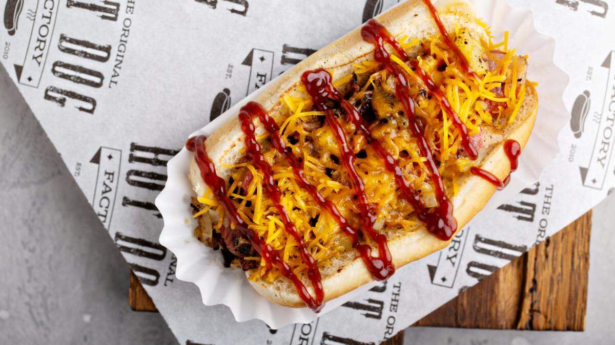 “This is not a normal ketchup and mustard experience,” The Original Hot Dog Factory Charlotte co-owner Anthony Hailey Sr. said. The Hawaiian Dog is topped with bacon, cheese, BBQ sauce, grilled onions and grilled pineapple.