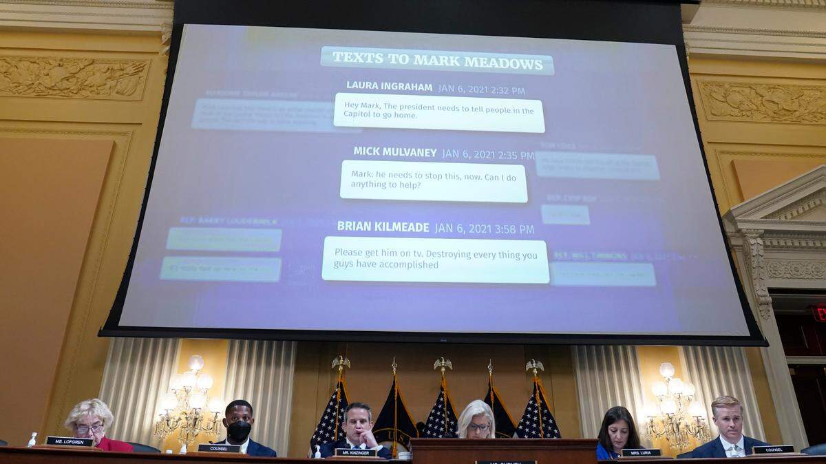 Text messages to former White House chief of staff Mark Meadows from Laura Ingraham, Mick Mulvaney and Brian Kilmeade are displayed on a screen during a July 21, 2022 hearing held by the Jan. 6 committee.