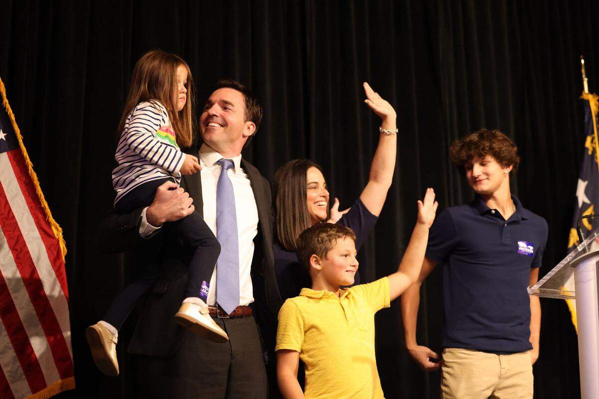 Then-state Sen. Jeff Jackson and his family greeted guests at Lenny Boy Brewing Co. in Charlotte on Tuesday, Nov. 8, 2022. Jackson declared victory in the 14th congressional district.