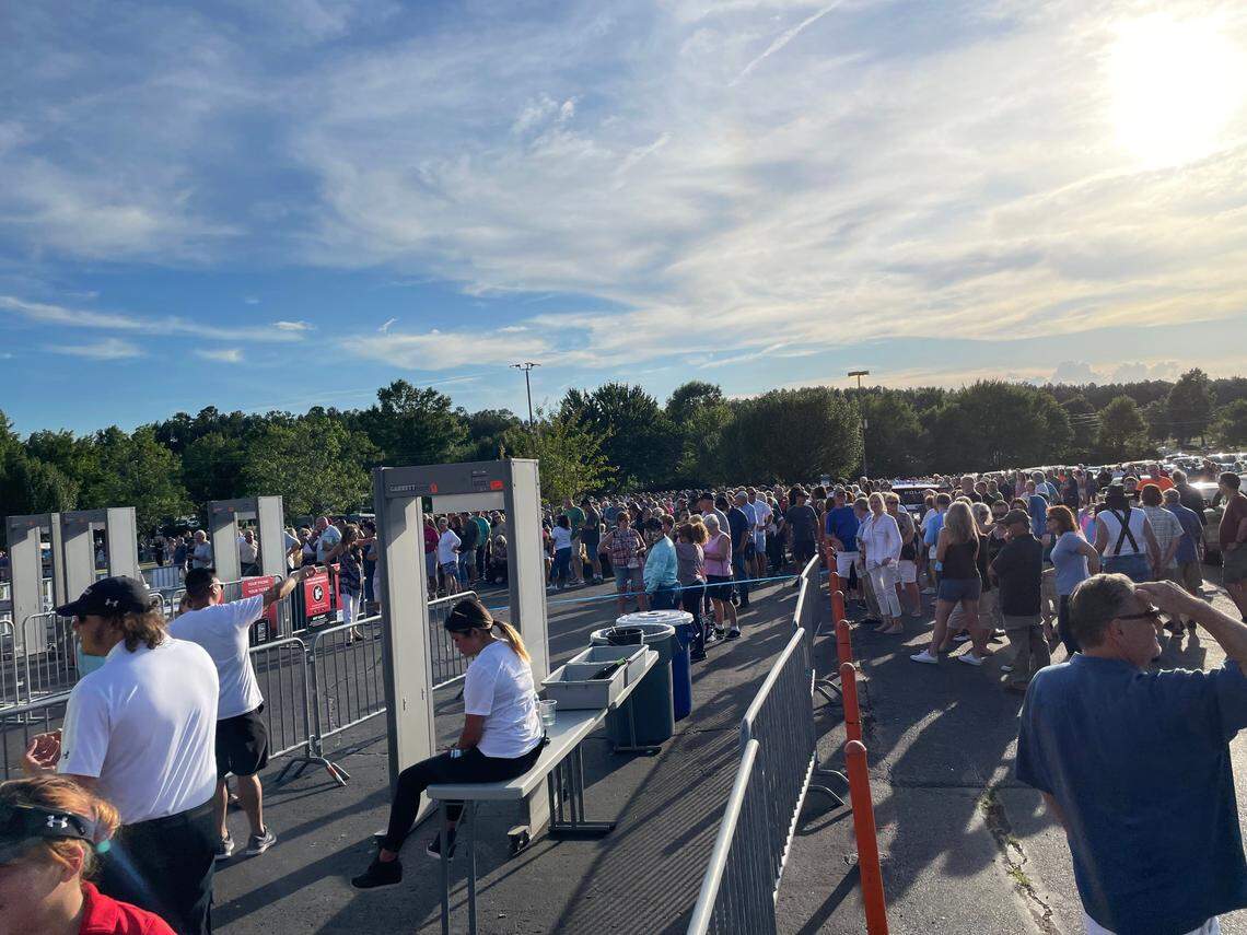 Crowds wait outside PNC Music Pavilion for the gates to open on Tuesday evening.