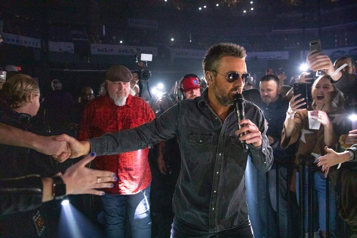 Eric Church wades into the crowd at Spectrum Center in Charlotte on Saturday night.