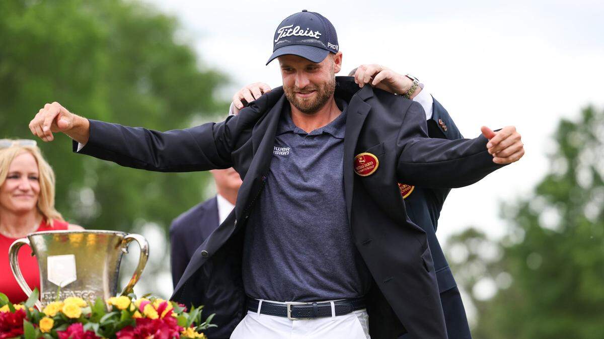 Wyndham Clark puts on the championship blazer after winning the Wells Fargo Championship on Sunday, May 7, 2023 at Quail Hollow Club. This is Clark’s first PGA Tour win.