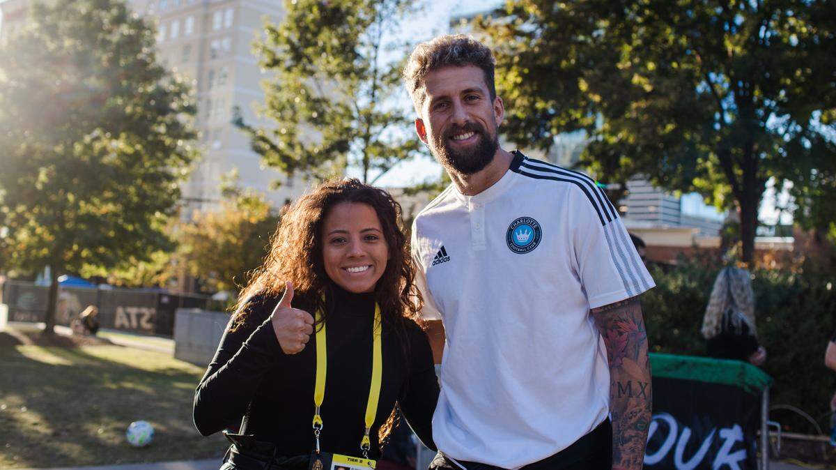 Charlotte FC player liason Elena Lemus with center-back Guzmán Corujo prior to the #MexTour match at Bank of America Stadium in Charlotte, N.C. on Oct. 27, 2021.