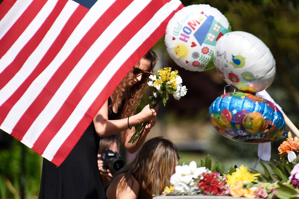 Mourners placed balloons and flowers outside of Stuart Auditorium in honor of Riley Howell. At least 1,000 mourners attended a memorial service for Riley Howell who was killed trying to disarm Trystan Andrew Terrell as he fired a hand gun in a UNC Charlotte classroom. Howell, a cadet in UNC Charlotte’s ROTC program, was given full military honors at his funeral. He is seen as a hero who saved the lives of other students after he tackled Terrell on Tuesday. The service was held at Stuart Auditorium at Lake Junaluska near Waynesville, N.C. on Sunday, May 5, 2019.