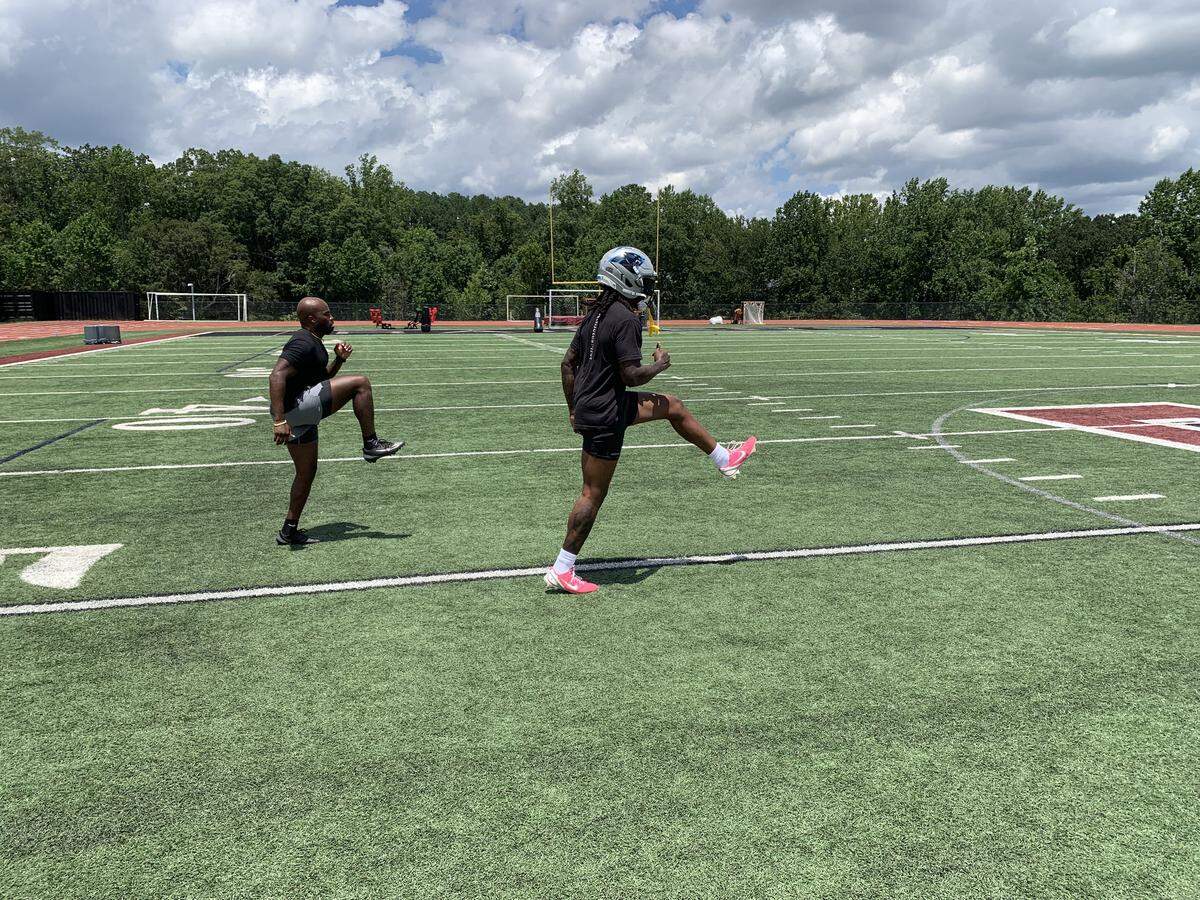 Carolina Panthers cornerback Jaycee Horn warms up during a workout with trainer Oliver Davis on July 18, 2025, at Alpharetta (Georgia) High School. 