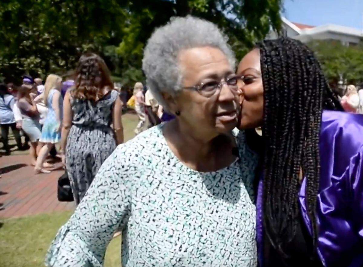 Natalia Little gives Barbara Rippy a hug after her graduation at East Carolina University in 2018.