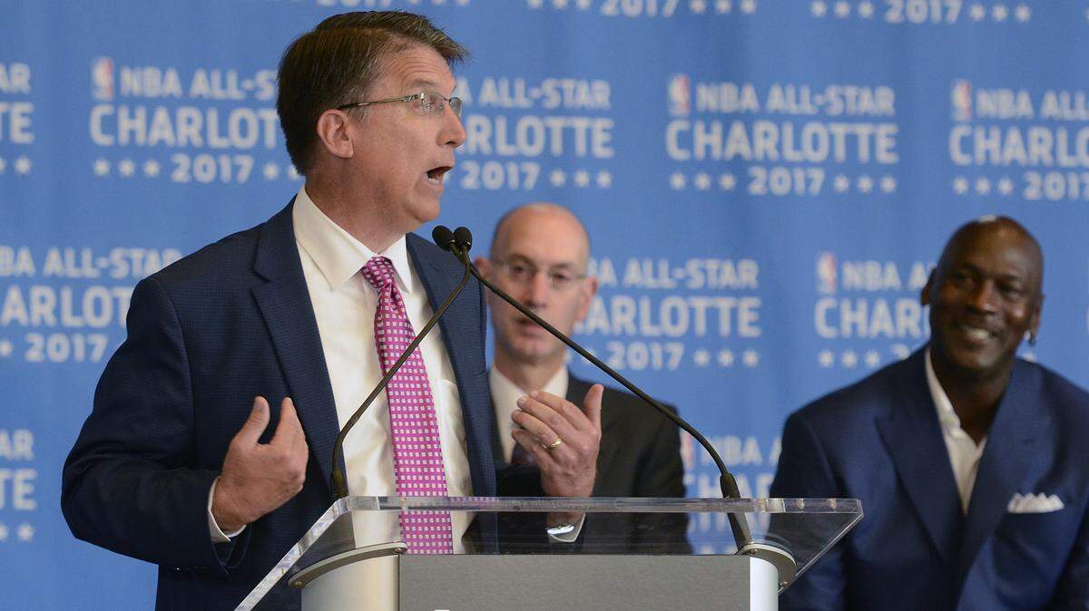 Former N.C. Governor Pat McCrory, left, thanks NBA Commissioner Adam Silver, center, during a press conference announcing the NBA would hold its All-Star Game in Charlotte in 2017. The NBA later pulled the All-Star Game out of Charlotte until 2019 because of national backlash surrounding HB2.