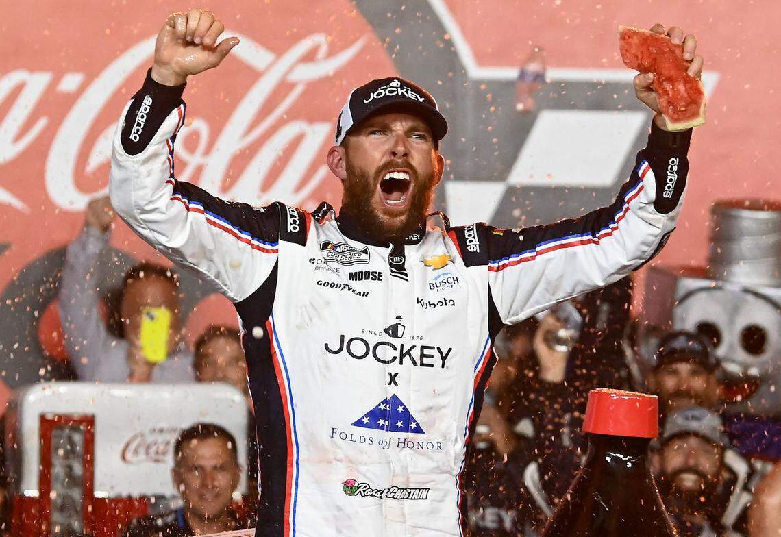With a piece of watermelon in his left hand, NASCAR Cup Series driver Ross Chastain celebrates winning the Coca-Cola 600 at Charlotte Motor Speedway in Concord, NC on Sunday, May 25, 2025.