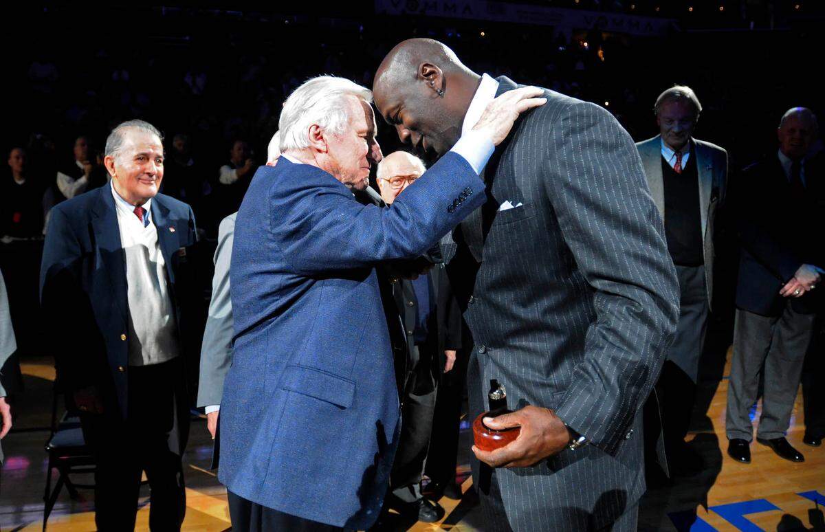 David T. Foster III’s 2010 photo of former North Carolina coach Dean Smith congratulating Michael Jordan after Jordan’s induction into the North Carolina Sports Hall of Fame.