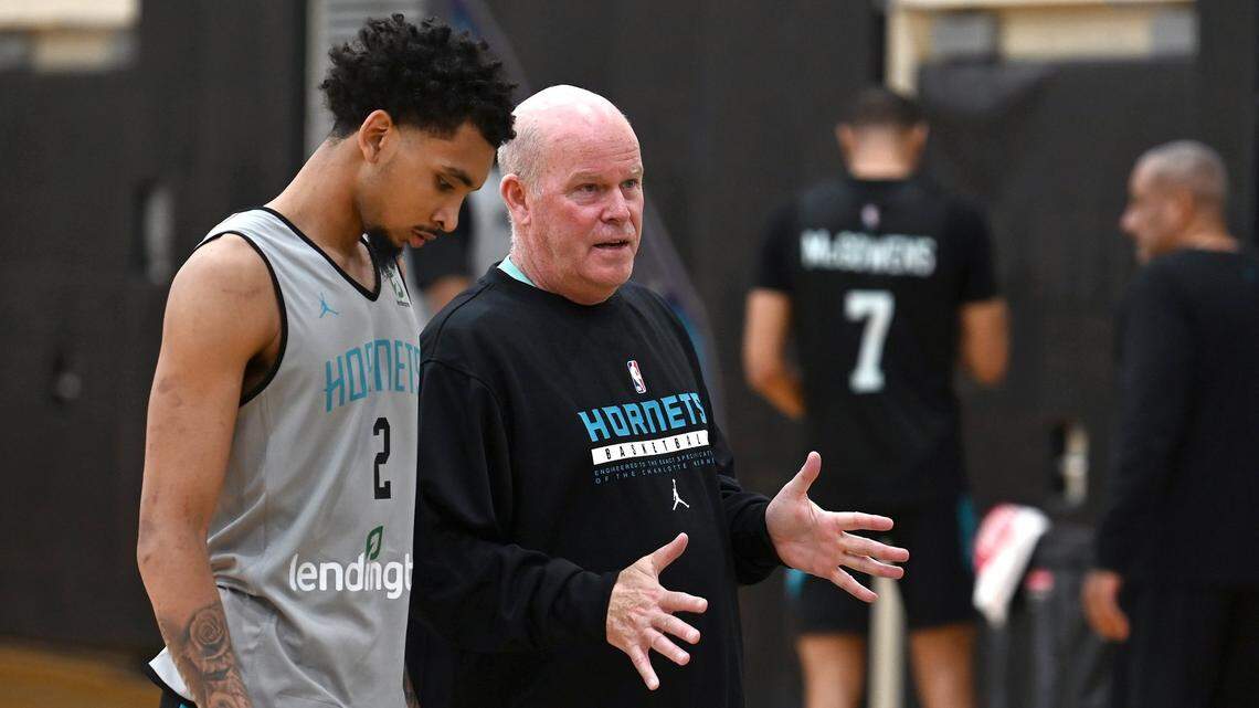 Charlotte Hornets head coach Steve Clifford, right, talks with guard James Bouknight, left, following practice on Tuesday, September 27, 2022.
