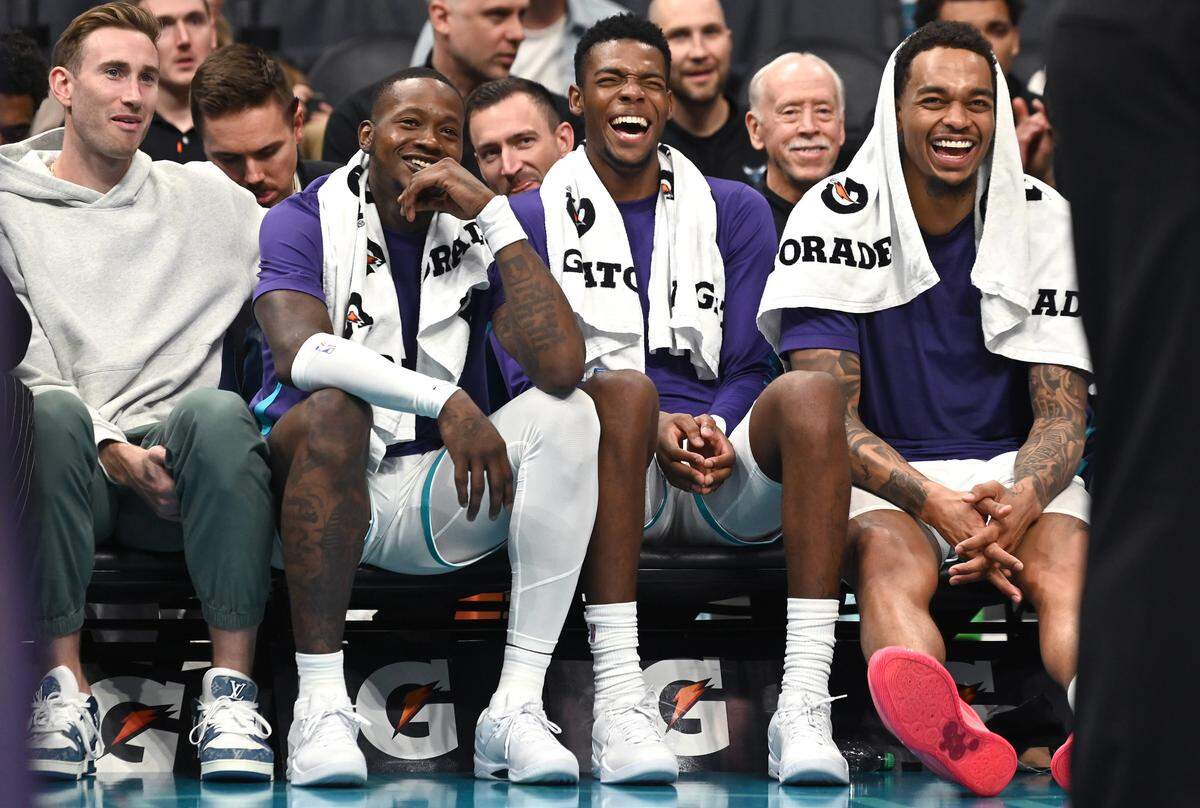 (L-R) Charlotte Hornets forward Gordon Hayward, guard Terry Rozier, forward/guard Brandon Miller and forward P.J. Washington joke with crew chief Tony Brothers during late fourth quarter action against the Oklahoma City Thunder on Sunday, October 15, 2023 at Spectrum Center in Charlotte, NC. The Hornets defeated the Thunder 117-115.