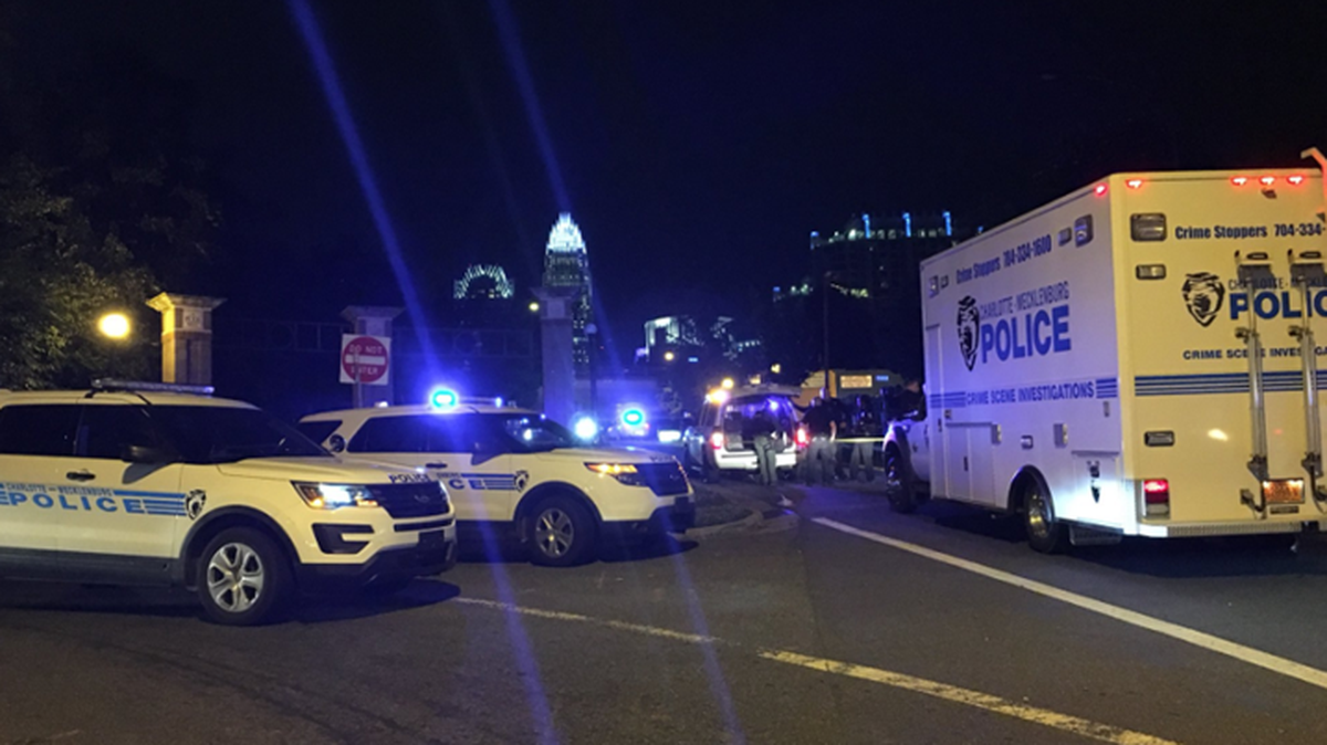 North Tryon Street was closed Monday in the 900 block as Charlotte-Mecklenburg Police searched for the suspect in a homicide.